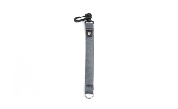 An 8-inch Northwest Sky (light grey) Key Strap with a snaphook at one end and a split-ring o-ring at the other.